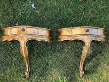 Load image into Gallery viewer, A pair of antique gold leaf French wall-mounted console tables