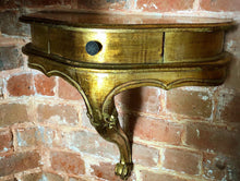 Load image into Gallery viewer, A pair of antique gold leaf French wall-mounted console tables
